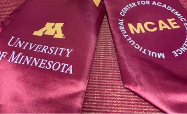 A maroon stole with a University of Minnesota M and MCAE