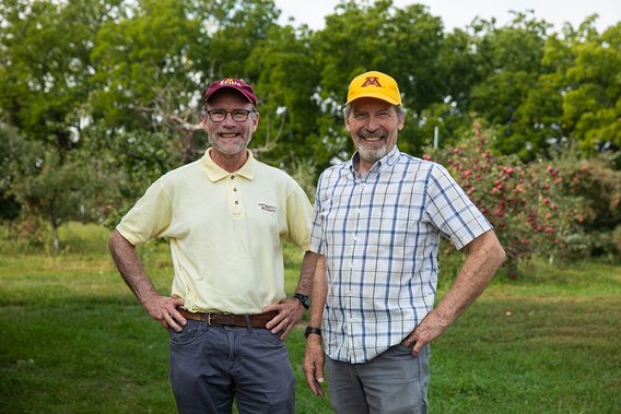 James Luby and David Bedford in an apple orchard at the University of Minnesota Horticultural Research Center