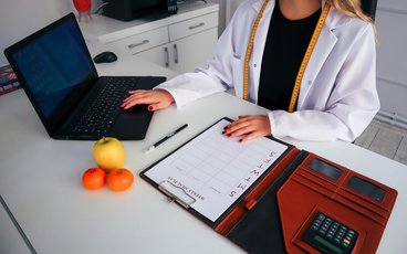 Dietitian looking at a computer. 