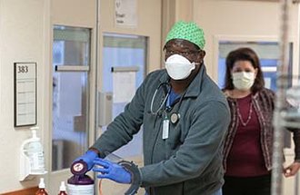 Healthcare providers wear masks at a hospital in St. Paul.