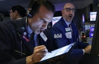 Traders Gregory Rowe and Peter Giacchi worked the floor of the New York Stock Exchange March 12, four days before the Dow Jones fell 12.9%, the second-biggest single-day decline ever.