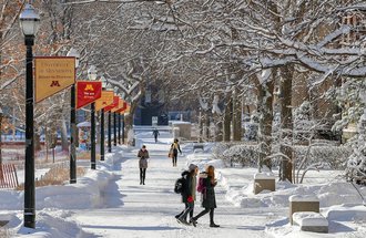 Students walking on U of M campus in winter.