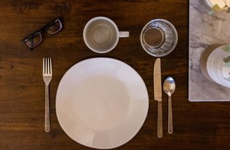 Place setting, empty dishes on a table. 