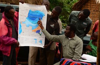Esakakondo "Al" Lohese points to a climate map of the Democratic Republic of the Congo.