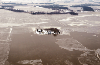Aerial view of farm in winter.