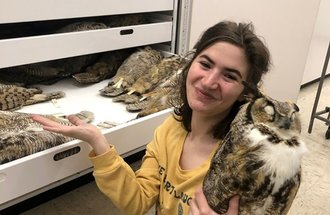 Netanya Sadoff with an owl specimen.