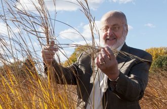 Professor Donald Wyse in a field. 